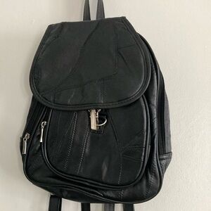 Black zippered backpack purse